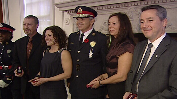 Ottawa Police Chief Charles Bordeleau poses with the medical team who tried to save an officer's life in 2009.