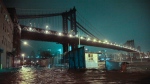 Streets are flooded under the Manhattan Bridge in the Dumbo section of Brooklyn, N.Y., Monday, Oct. 29, 2012. (AP/Bebeto Matthews)