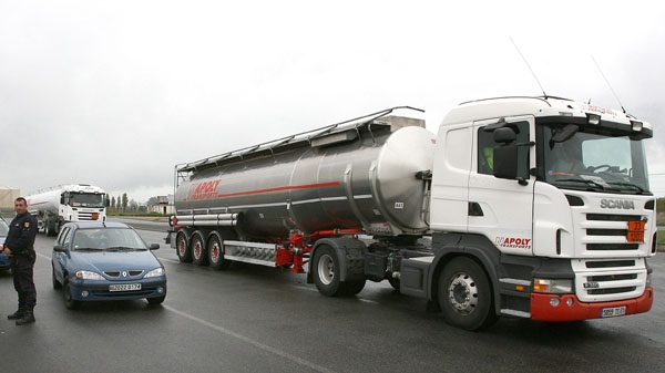 A full tanker truck leaves a fuel depot near the closed oil refinery of Donges, western France, Saturday, Oct. 23, 2010. (AP / David Vincent)