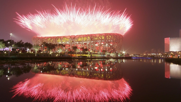 Fireworks explode over the National Stadium during opening ceremony of the Olympic Games in Beijing on Aug .8, 2008. (AP Photo/Bullit Marquez, file)