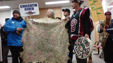 Protesters rallying in support of wild salmon brought a deer skin signed by supporters to federal court in Vancouver, where the Cohen Commission is probing the decline of sockeye stocks. Oct. 25, 2010. (CTV)