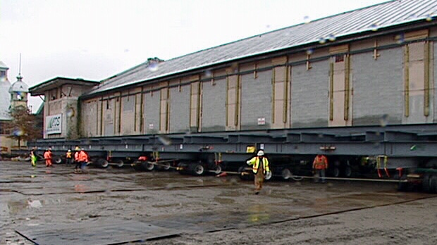 Lansdowne Park's historic Horticulture building has started a 120 metre roll across its parking lot Friday, Nov. 2, 2012.