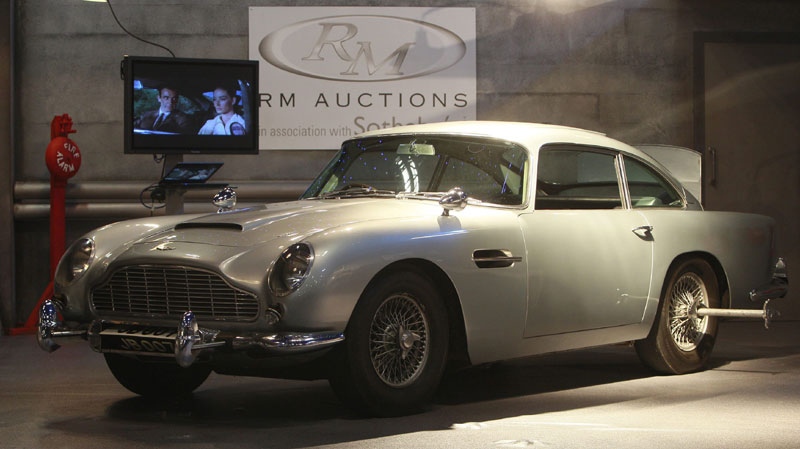 The 'James Bond' 1964 Aston Martin DB5, is viewed by the media, in London, Tuesday, Oct. 26, 2010. (AP Photo/Alastair Grant)