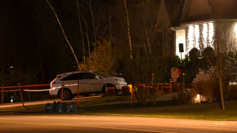 Orange police tape surrounds the driveway in Blainville where mafia second-in-command Joe Di Maulo was assassinated (Nov. 4, 2012. CTV Montreal/Cosmo Santamaria)