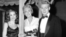 In this Oct. 29, 1960 file photo, Jane Fonda, left, and James MacArthur, right, poses with Celeste Holm, starring in the play "Invitation to a March," outside the Music Box Theatre in New York on opening night. (AP Photo / Lippman)