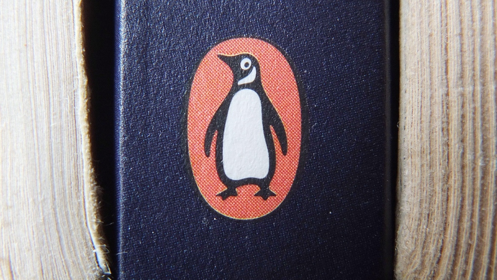 A book on display with the penguin logo.