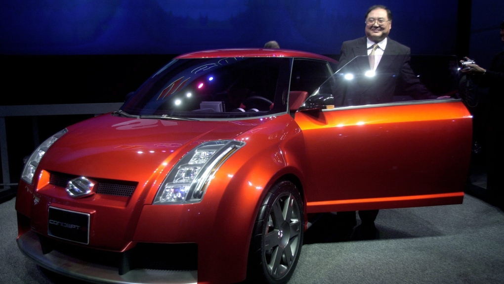 Rick Suzuki poses with a Suzuki Concept-S