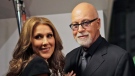 Celine Dion, left, poses with her husband Rene Angelil, pose as they arrive for the premiere of the film "Celine: Through the Eyes of the World" in Miami Beach, Fla., on Feb. 16, 2010. (AP / Lynne Sladky)