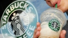 A Starbucks customer drinks a beverage outside Starbucks, in Beverly, Mass. Starbucks Corp.  (AP / Lisa Poole) 