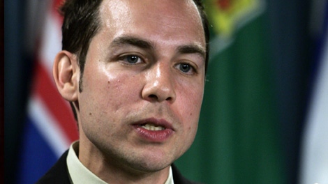 Alex Munter, of Canadians for Equal Marriage, comments on the governments decision to wait to try and pass the same-sex bill, at a news conference in Ottawa Thursday June 16, 2005. (CP PHOTO/Tom Hanson)