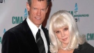 Country singer Randy Travis and his wife Elizabeth arrive at the 42nd Annual CMA Awards in Nashville, Tenn., in this Nov. 12, 2008 file photo. (AP / Peter Kramer)