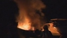 Firefighters battle a boat fire at the Toronto Humber Yacht Club early Thursday, Nov. 8, 2012.