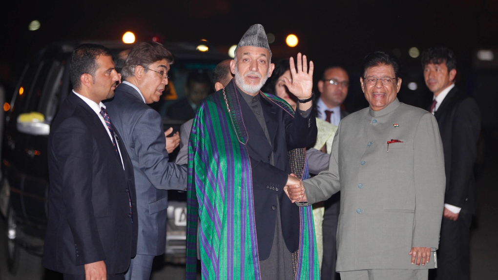  Hamid Karzai waves on Nov. 11, 2012.