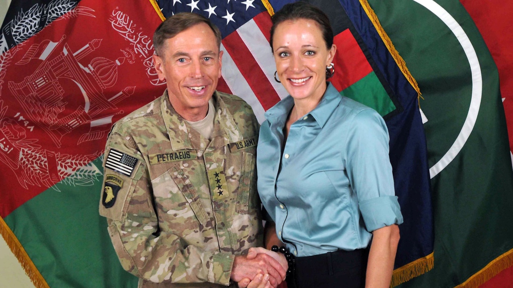 David Petraeus shaking hands with Paula Broadwell