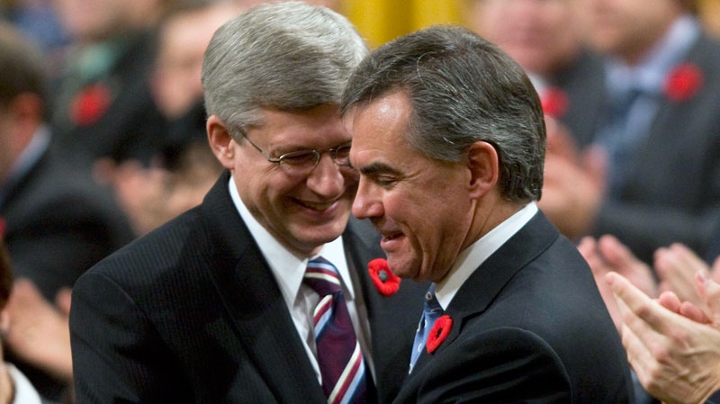 Prime Minister Stephen Harper shakes hands with Minister of the Environment Jim Prentice after he announced he would be leaving politics following Question Period in the House of Commons on Parliament Hill in Ottawa, Thursday November 4, 2010. (Adrian Wyld / THE CANADIAN PRESS)