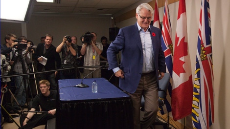 British Columbia Premier Gordon Campbell leaves a news conference after taking questions from the media in downtown Vancouver, Thursday, Nov 4, 2010. Premier Campbell announced Wednesday, November 3, 2010, that he is resigning as premier. THE CANADIAN PRESS/Jonathan Hayward