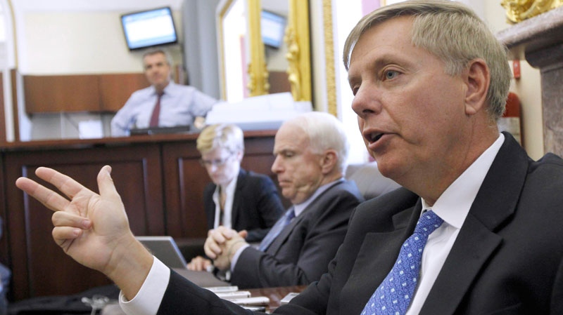 Sen. Lindsey Graham, R-S.C., right, talks with reporters on Capitol Hill in Washington on Sept. 21, 2010. (AP / Alex Brandon)