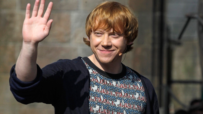 Rupert Grint greets fans during the grand opening cermonies of the Wizarding World of Harry Potter at Universal Orlando theme park in Orlando, Fla., Friday, June 18, 2010. (AP / John Raoux)