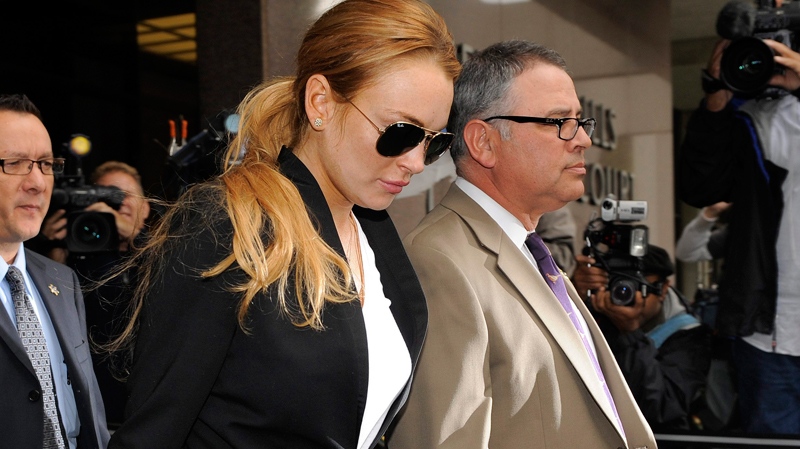 Lindsay Lohan exits a probation violation hearing at Beverly Hills Courthouse in Beverly Hills, Calif., Friday, Oct. 22, 2010. (AP / Chris Pizzello)