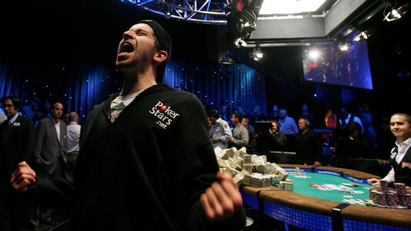 Jonathan Duhamel, 23, lets out a yell after winning the World Series of Poker (AP Photo/Isaac Brekken)