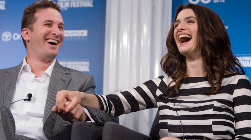 Rachel Weisz and director Darren Aronofsky share a laugh during a news conference for the movie 'The Fountain' at the Toronto International Film Festival in Toronto, Ont. Tuesday, Sept. 12, 2006. (Jonathan Hayward / THE CANADIAN PRESS)