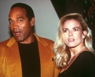 O.J. Simpson and his wife, Nicole Brown Simpson, celebrate the opening of the Harley-Davidson Cafe in this Oct. 19, 1993 file photo. (AP / Paul Hurschmann)