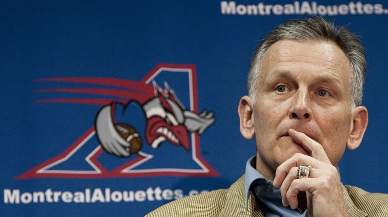 Larry Smith, president and CEO of the Montreal Alouettes, ponders a question after announcing that he will be leaving the CFL club as of Dec. 31, 2010 during a news conference Monday, November 8, 2010 in Montreal. (THE CANADIAN PRESS/Paul Chiasson)