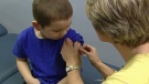 A chid gets patched up after receiving the flu shot at CHEO.