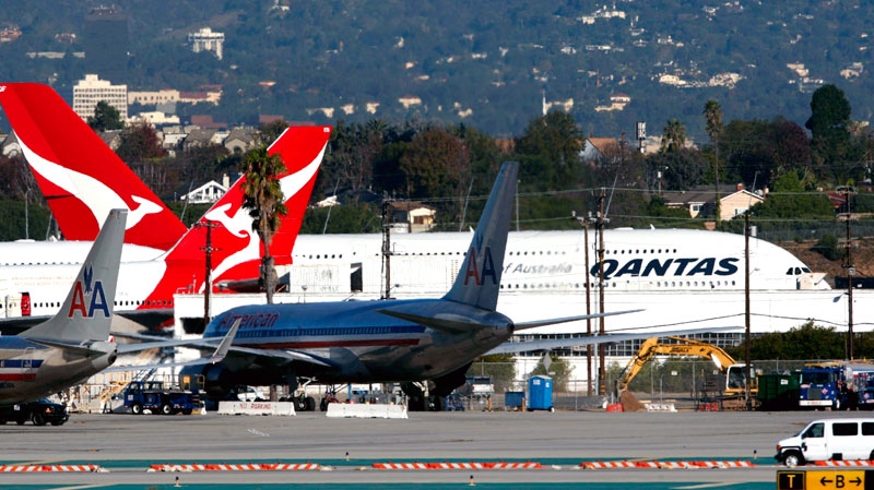 Two Qantas A380 superjumbo jets are shown grounded on the tarmac at Los Angeles International Airport Friday, Nov. 12, 2010, before being inspected. (AP / Nick Ut)