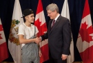 Before his concert in Ottawa Justin Bieber was presented with a Diamond Jubilee Medal from Prime Minister Stephen Harper on Friday, Nov. 23, 2012. (PRIME MINISTER’S OFFICE PHOTO)