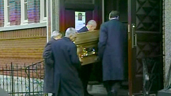 Pallbearers carry the casket of Nicolo Rizzuto into Montreal church Notre-Dame-de-la-Defense, Monday, Nov. 15, 2010.