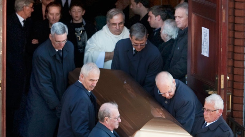Libertina Rizzuto follows the casket of her husband, Nicolo, from the church after funeral services for reputed organized crime boss Nick Rizzuto Monday, November 15, 2010 in Montreal. (Ryan Remiorz / THE CANADIAN PRESS)
