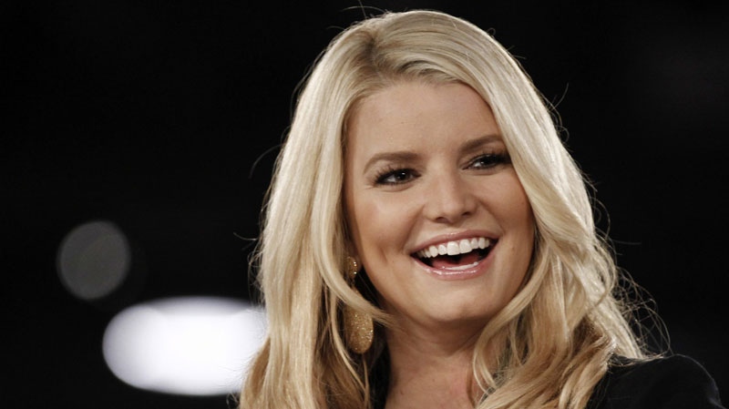 Jessica Simpson speaks onstage at Night at the Village during the Women's Conference in Long Beach, Calif., Monday, Oct. 25, 2010. (AP Photo/Matt Sayles)