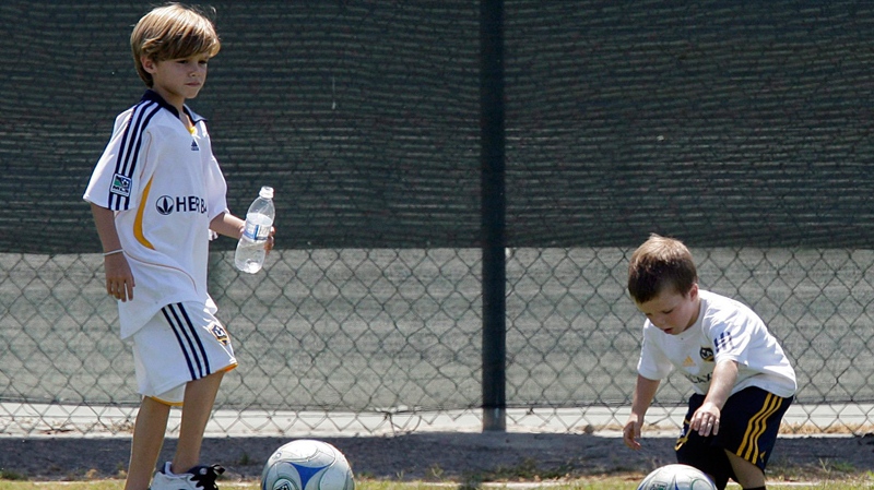 David Beckham's sons, Romeo, left, and Cruz play during Beckham's soccer practice in Carson, Calif., Monday, July 13, 2009. (AP / Jae C. Hong)