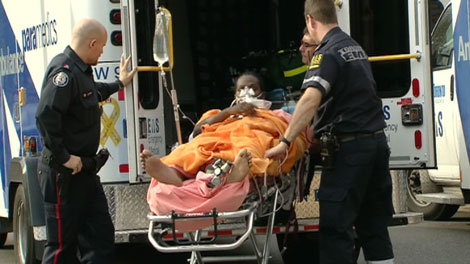 A shooting victim is taken into an ambulance in Toronto after an incident on Tuesday, Nov. 16, 2010. Two men were arrested in the shooting.