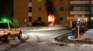 Flames billow out of this first-floor apartment unit where a woman was killed Nov. 27, 2012.