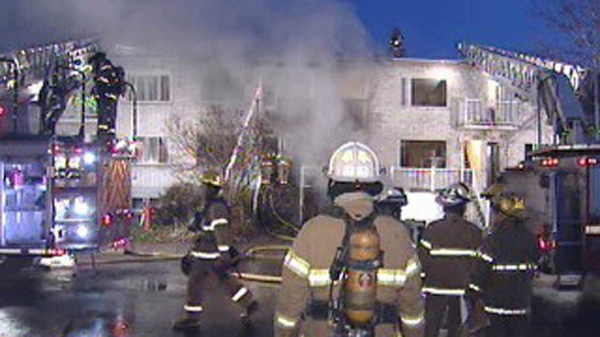 Firefighters in LaSalle deal with a 3-alarm blaze that started in the basement of a rowhouse. (Nov. 16, 2010)