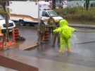 A hazmat worker gets sprayed with water after dealing with a gas leak outside the YMCA-YWCA on Argyle Street, Wednesday, Nov. 17, 2010. Image courtesy: Ottawa Fire Services