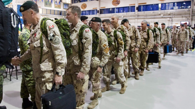 Royal 22nd Regiment soldiers line up in a drill hall as they leave for Afghanistan, Monday, November 15, 2010 at CFB Valcartier, Que. (Jacques Boissinot / THE CANADIAN PRESS)