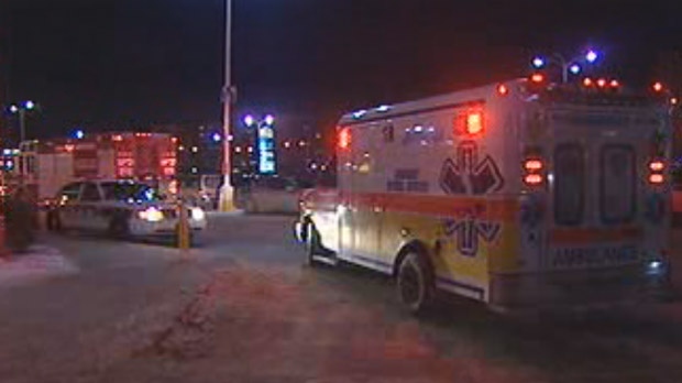 Police and emergency crews respond on Nov. 28, 2012 after a 40-year-old woman was robbed and assaulted near Grant Park Shopping Centre in Winnipeg.