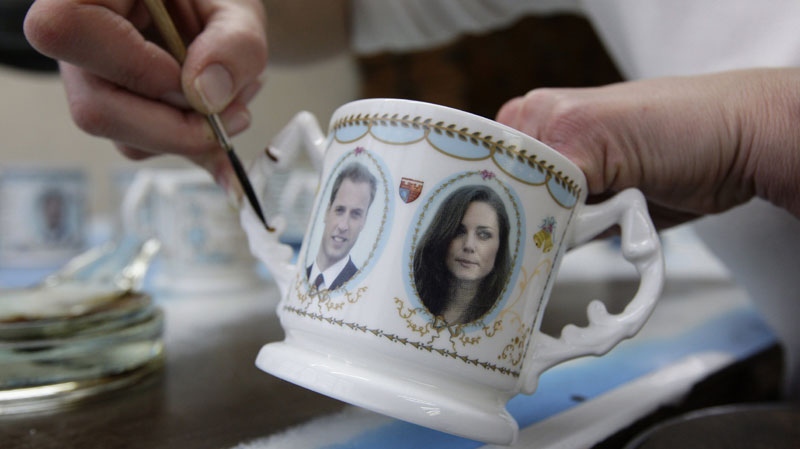 Guilder Claire Wright decorates a Loving Mug to mark the engagement of Prince William and Kate Middleton at Aynsley China in Stoke-on-Trent, England, Wednesday, Nov. 17, 2010. (AP Photo/Jon Super)