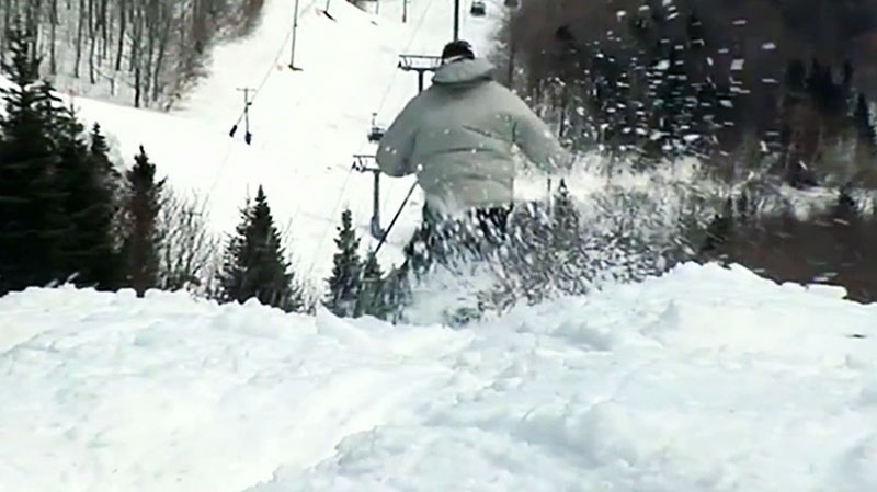 Man goes skiing down a hill