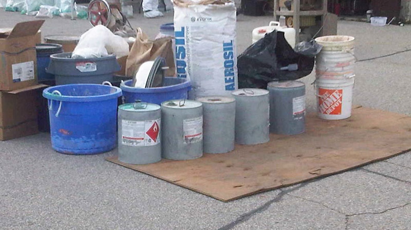 Chemical containers sit outside a suspected drug lab at an industrial building in Brantford, Ont. on Friday, Nov. 19, 2010. (CTV News / Meghan Furman)