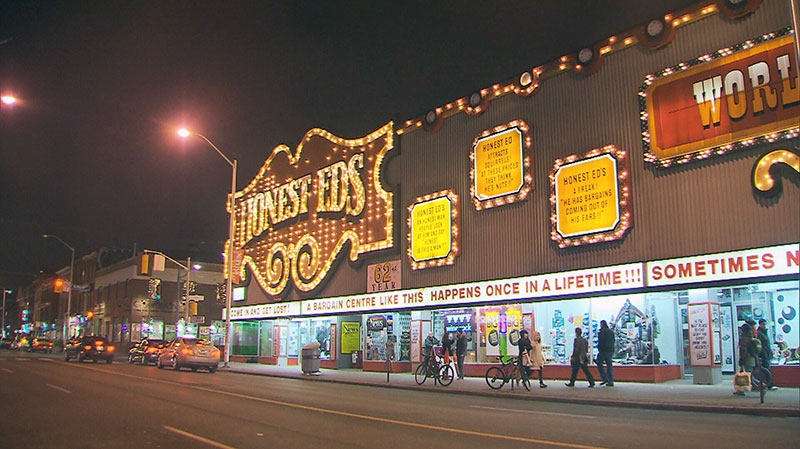 People are seen walking in front of Honest Ed’s in Toronto in this undated photo.