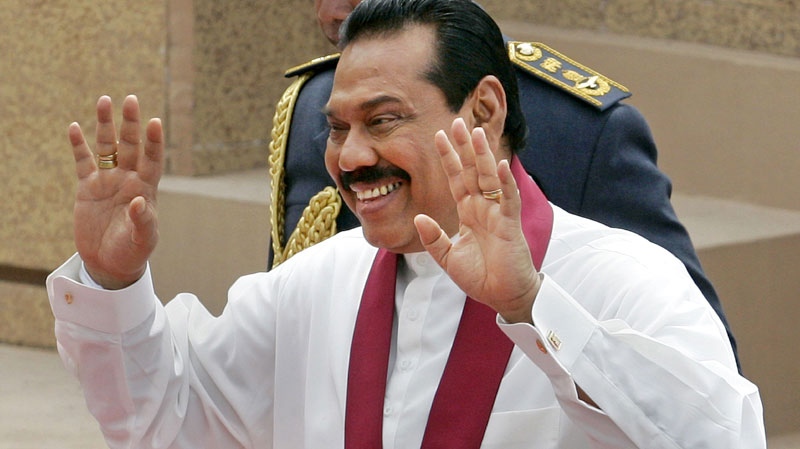 Sri Lankan President Mahinda Rajapaksa gestures during his swearing-in-ceremony in Colombo, Sri Lanka, Friday, Nov. 19, 2010. (AP / Chamila Karunarathne)