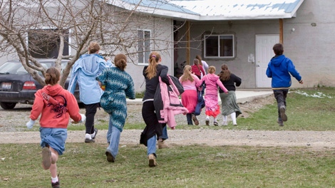 Children run back to class following a recess at Mormon Hills school in the polygamous community of Bountiful, B.C. in this April 21, 2008 photo. THE CANADIAN PRESS/Jonathan Hayward