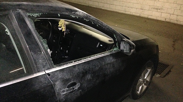 Parked car with smashed window