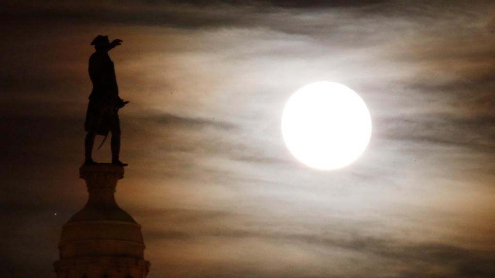 Moon shines over the Trenton Battle Monument.