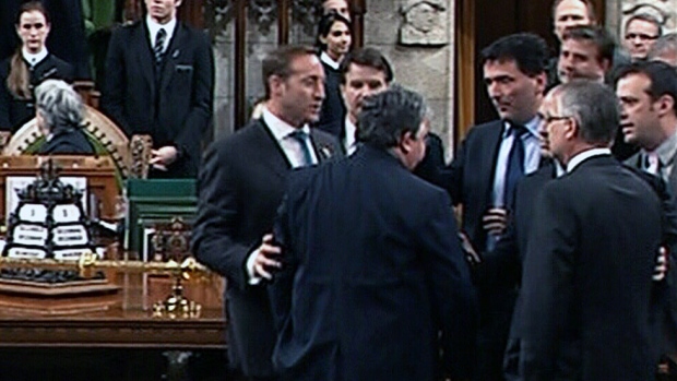 MPs scuffle on the floor of the House of Commons