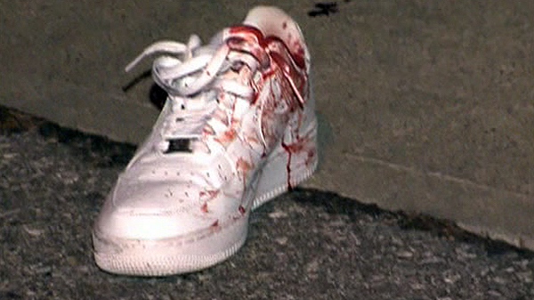 A bloody shoe left behind at one of eight shooting scenes in Toronto between Saturday, Nov. 20 and Sunday, Nov. 21, 2010.